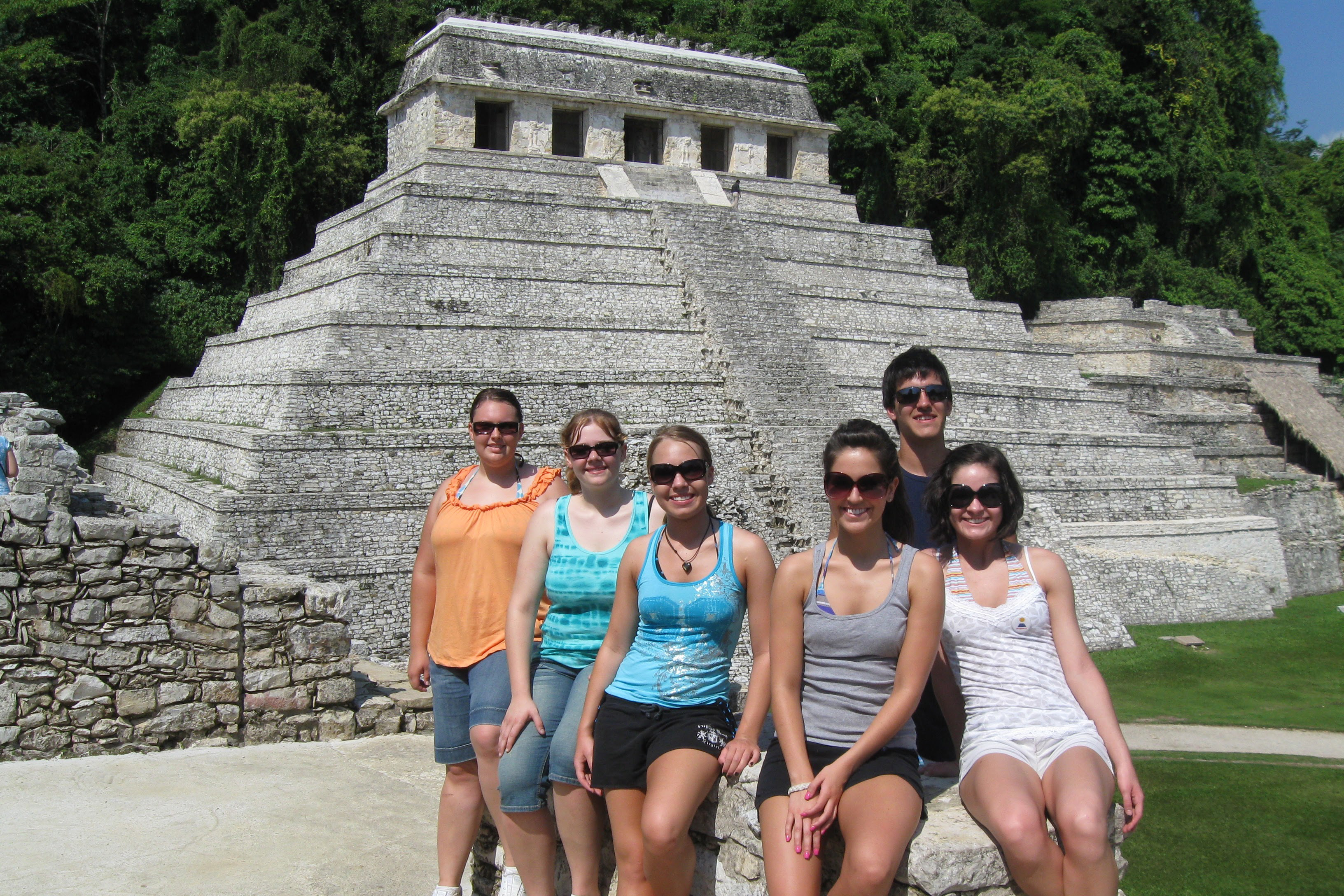 Students standing in front of a Mayan pyramid in Mexico